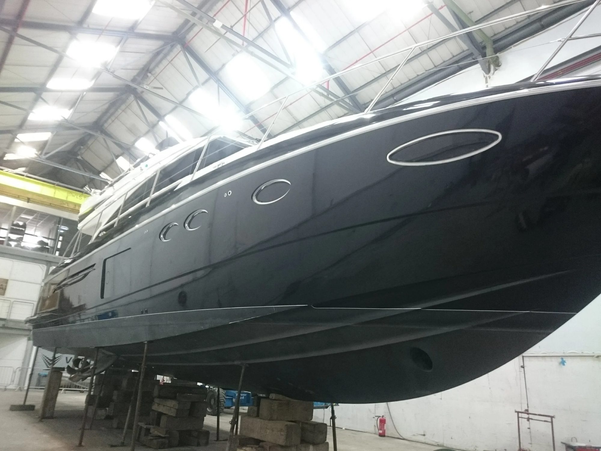 Dark metallic hull wrap on a Fairline Targa, low angle